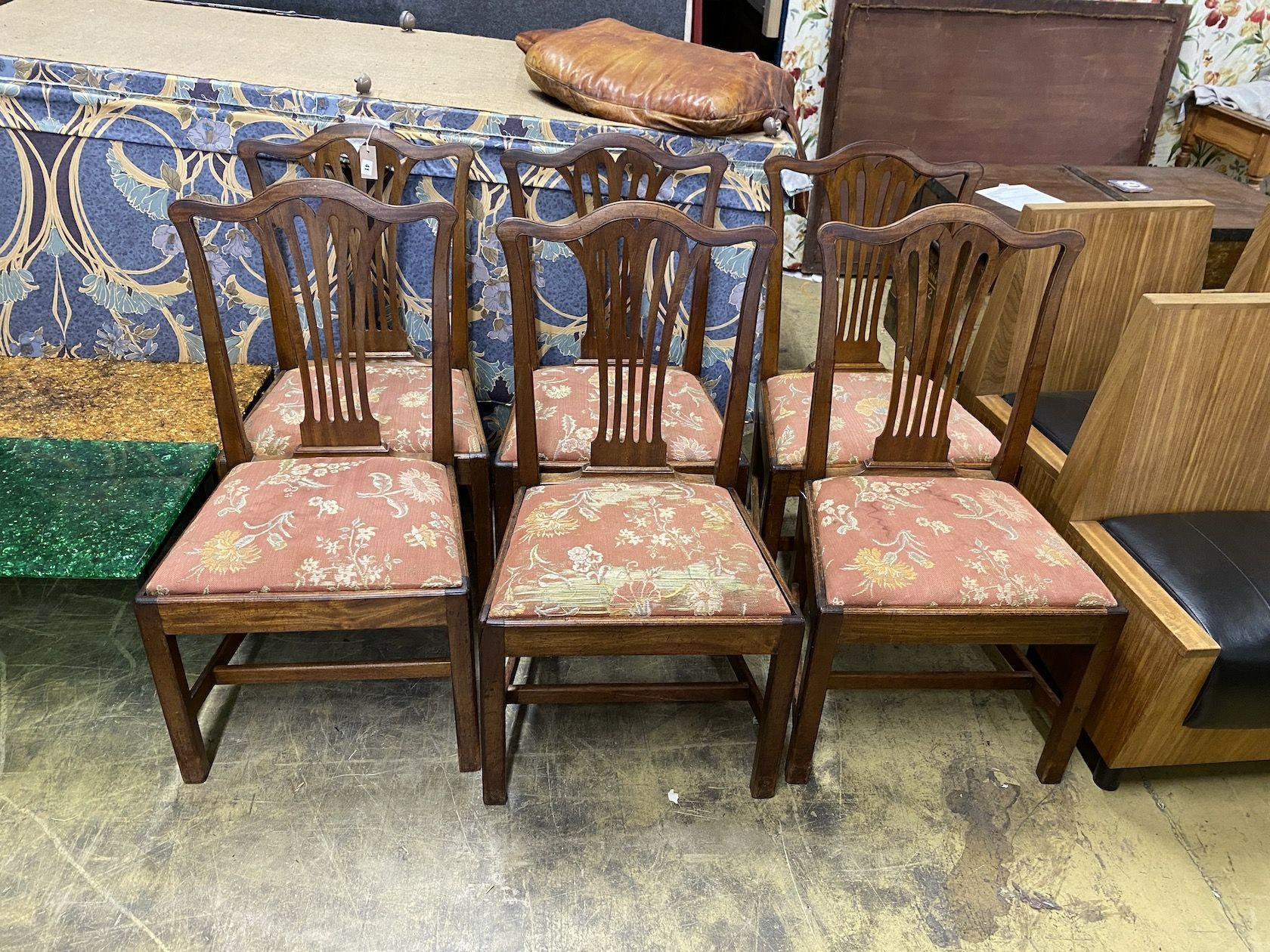 A set of six George III provincial mahogany dining chairs